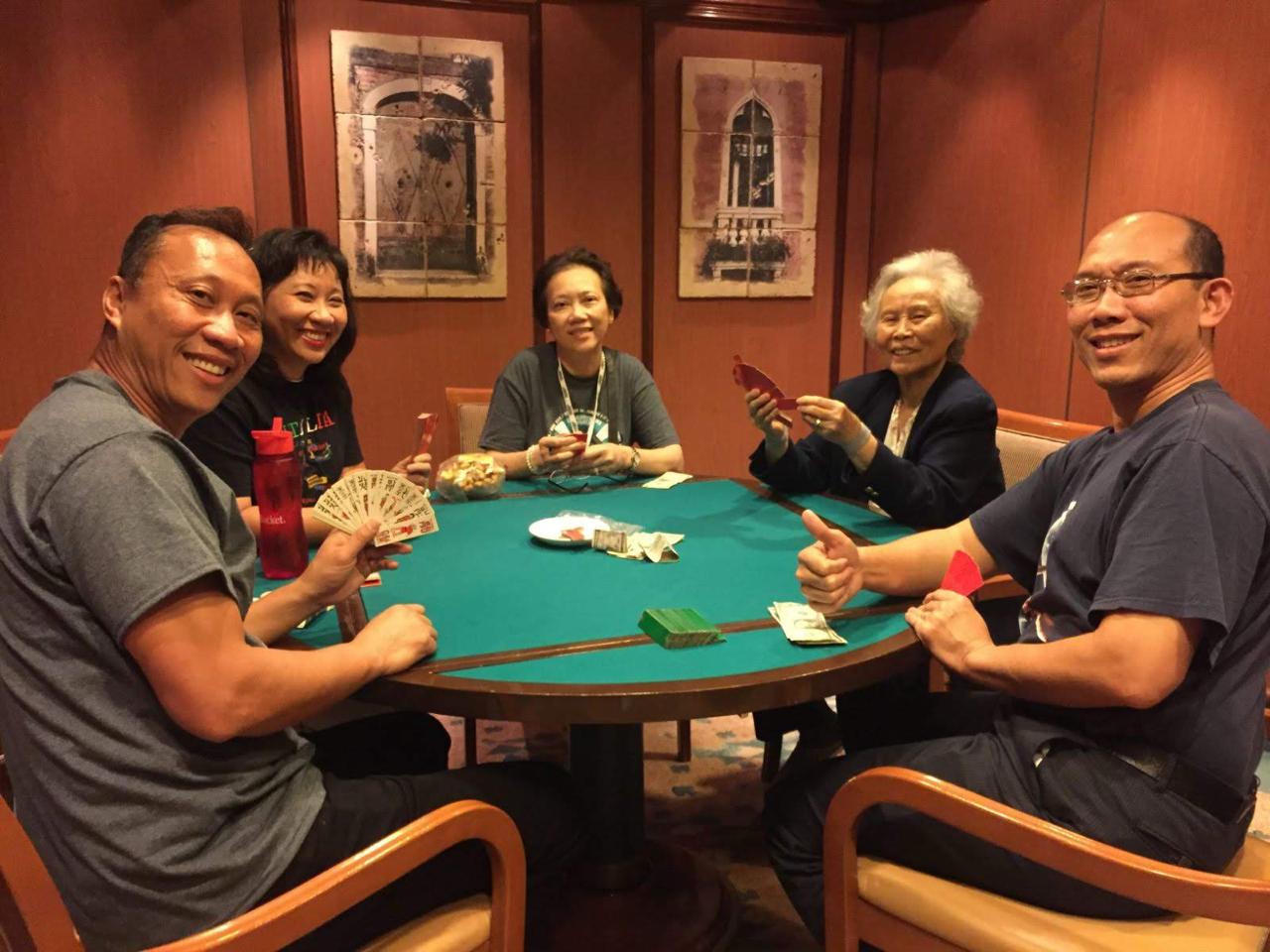 Family playing Chắn together